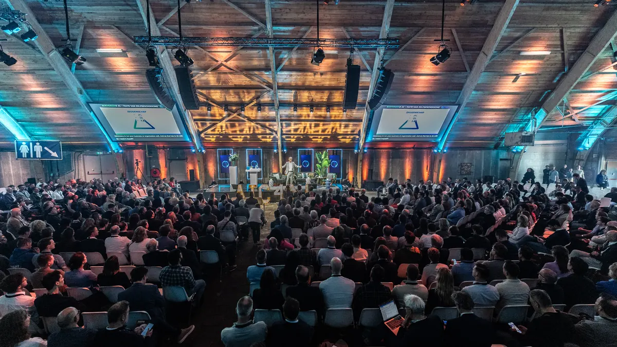 Volle zaal tijdens een evenement van AI Coalitie voor Nederland